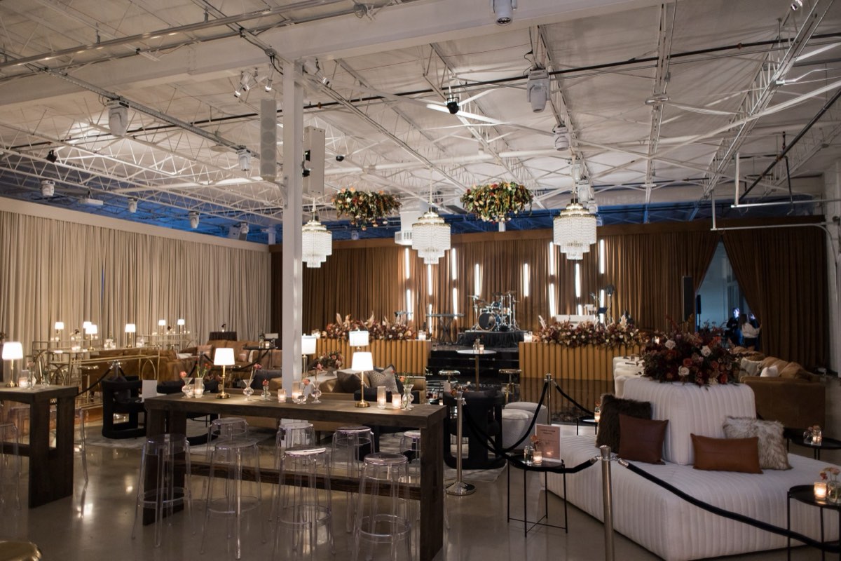 Elegant gala setup with crystal chandeliers, draping, and lounge seating at Astoria Event Venue